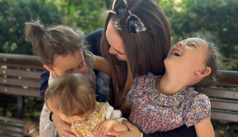 Why We Spend Our Summers in London Mother with her three daughters enjoying a summer day in London